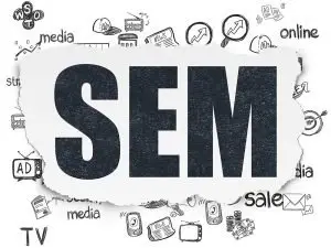 Large letters "SEM" on a torn strip of white paper surrounded by hand-drawn marketing doodles including a TV, newspaper, charts and the word "online"