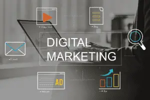"Digital Marketing" over a black-and-white photo of hands typing on a laptop, ringed by E-mail, Blog, SEO, Ad and ROI icons.