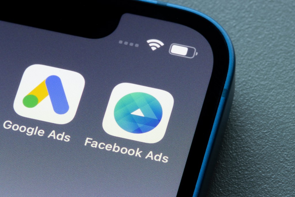 Google Ads and Facebook Ads apps on a phone screen