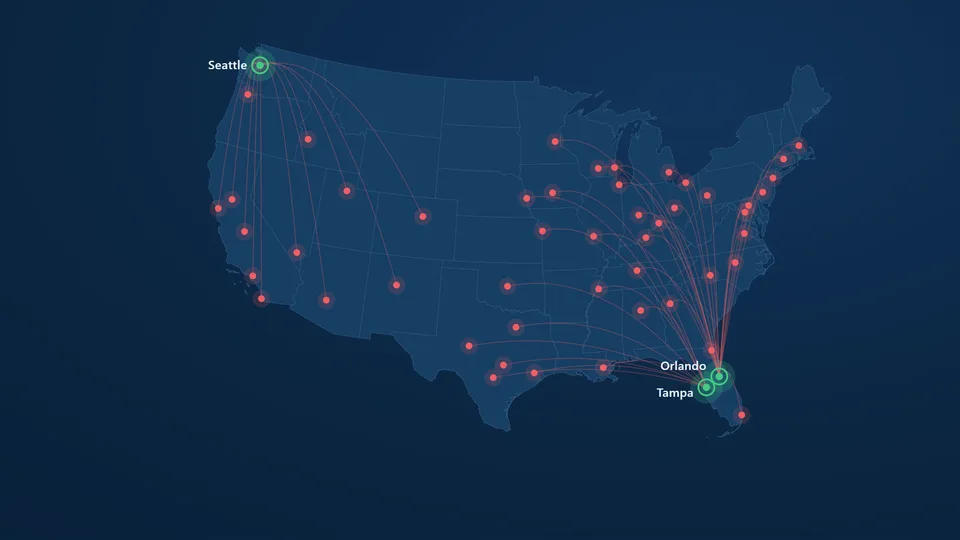 Map of the United States showing franchise locations as coral pins across major metros, with Actuate Media’s Seattle, Orlando, and Tampa offices marked and connected to each market